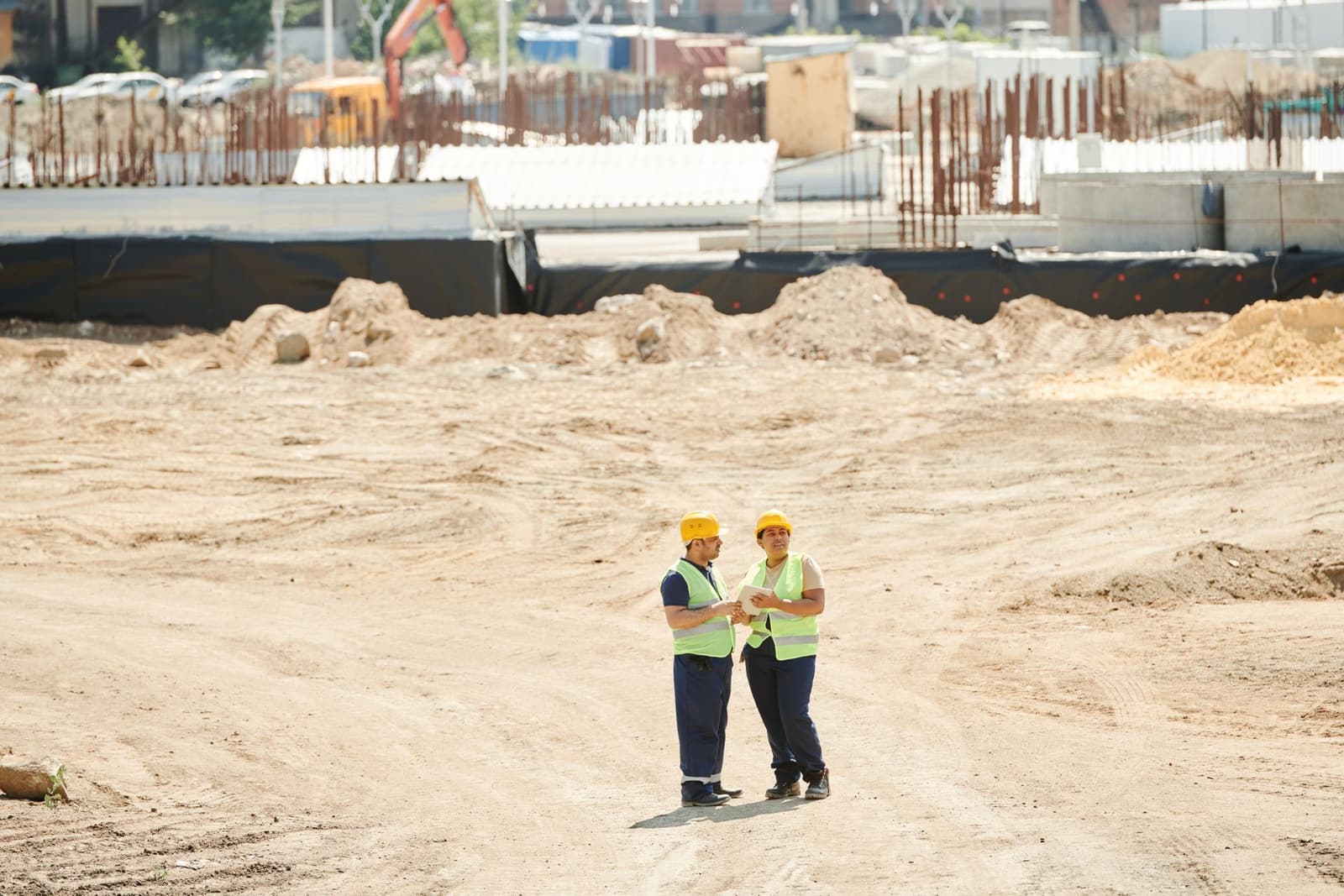 Construction crew reviewing plans on a Wisconsin job site